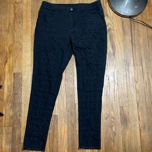 Fully cutout black skinny jeans with frayed hem